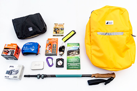 Hiking backpack with contents displayed Hiking backpack with contents displayed