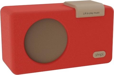 SMPL music liftplayer a SMPL music liftplayer, which is orange with a large brown play button