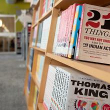 Photo of books on a shelf featuring "21 Things You May Not Know About the Indian Act"