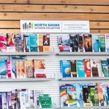 North Shore Authors Collection books on a library shelf