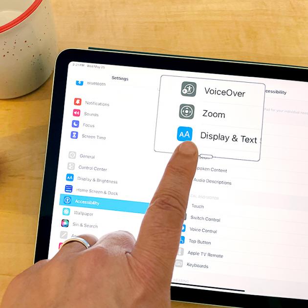 Person using accessibility settings on an ipad