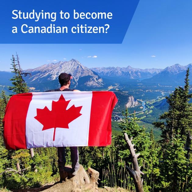 Citizenship Test A man standing on top of a cliff from behind, holding Canada flag at his back