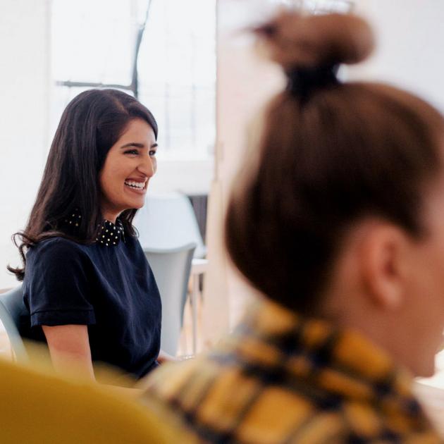 English conversation skills for the workplace Women smiling and talking sitting in circle