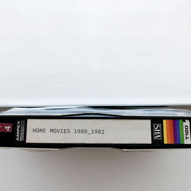 Photo of a VHS tape with the label "Home movies 1980-1982)