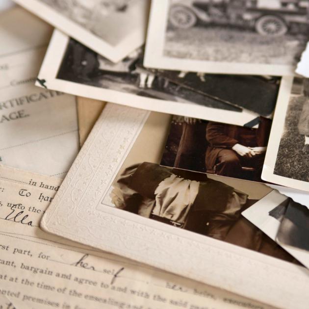 Family research and genealogy Old sepia-toned photographs and family history documents