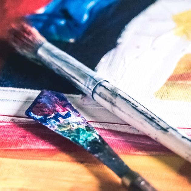 Art therapy workshop Paint brushes and canvas with abstract art