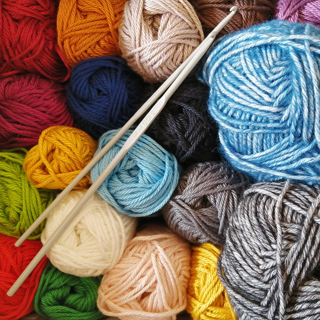 Balls of yarn and wool with crochet hooks
