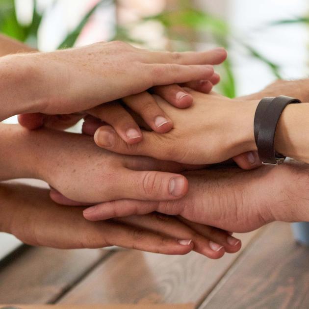 Hands stock on top of each other