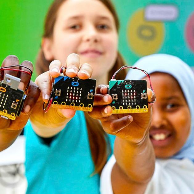 Children holding microchips