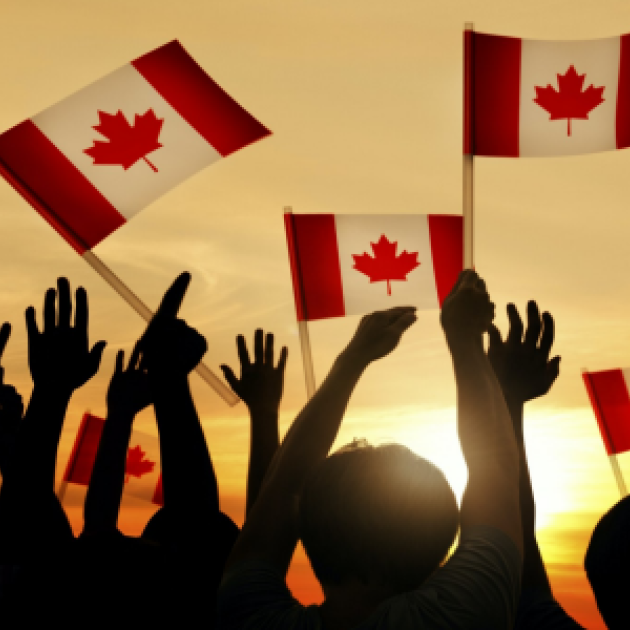 People holding Canadian flags