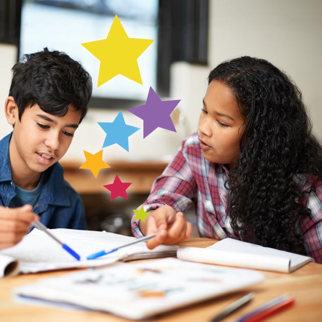 Two children looking at school books with pen in hand, colourful stars coming out of pages