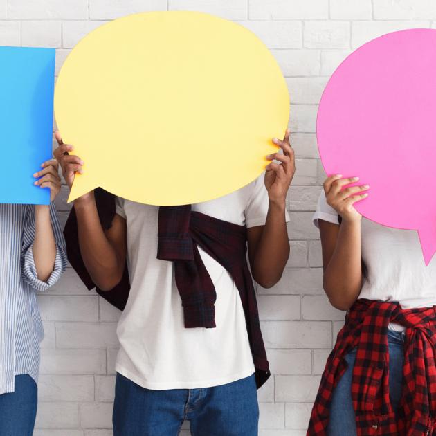 The Language Lab — English conversation for teens Three youth hold up speech bubble signs covering their faces