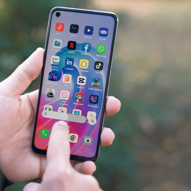 someone holding an android phone someone holding an android phone
