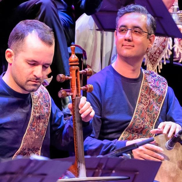 Music and talk - neynava ensemble Two people playing Iranian traditional musical instruments, one with eyes closed absorbed in the music