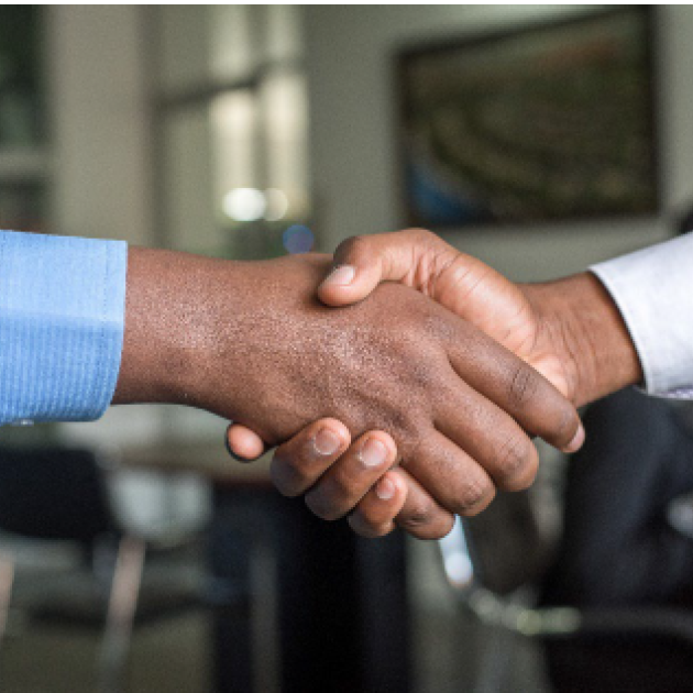 Finding a professional job in Canada Two people handshaking
