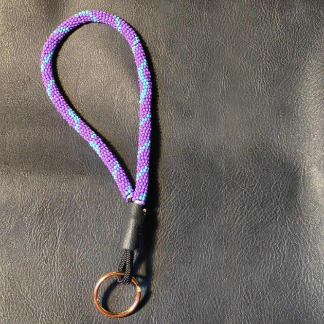 a purple and blue beaded keychain