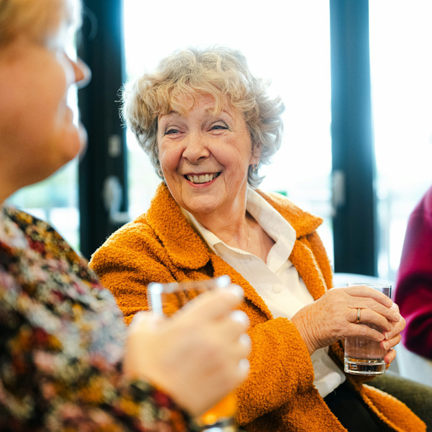 two senior women enjoying a cup of tea together