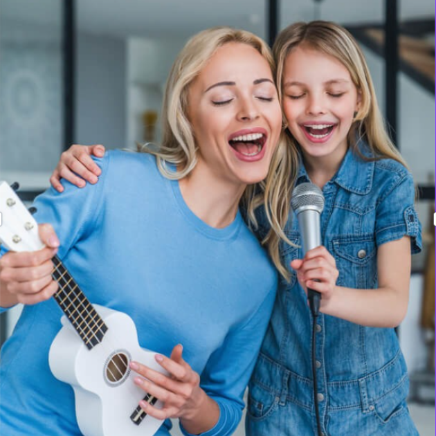 Two person singing and playing music