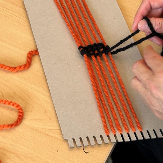 Strands of wool being woven