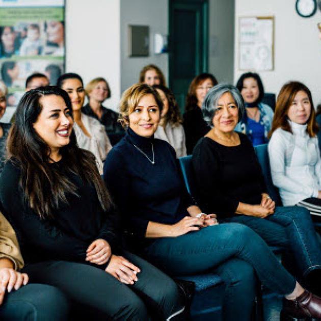 A person is talking to a group of people