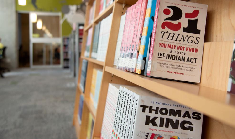 Photo of books on a shelf featuring "21 Things You May Not Know About the Indian Act"