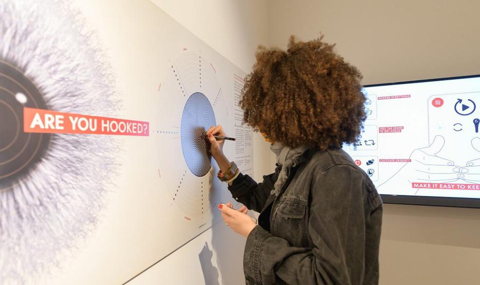 a person participating in an interactive exhibition