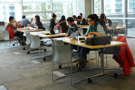 People sitting at study tables in the library